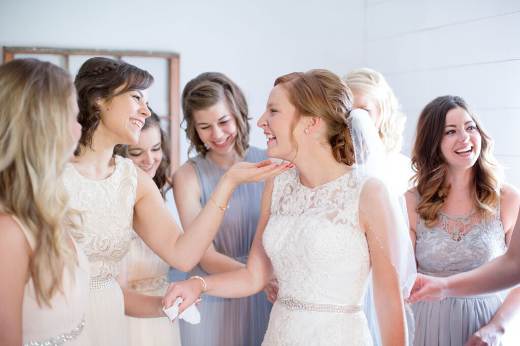 bride reveal with bridesmaids by lake of the ozarks wedding photographer The Bennetts