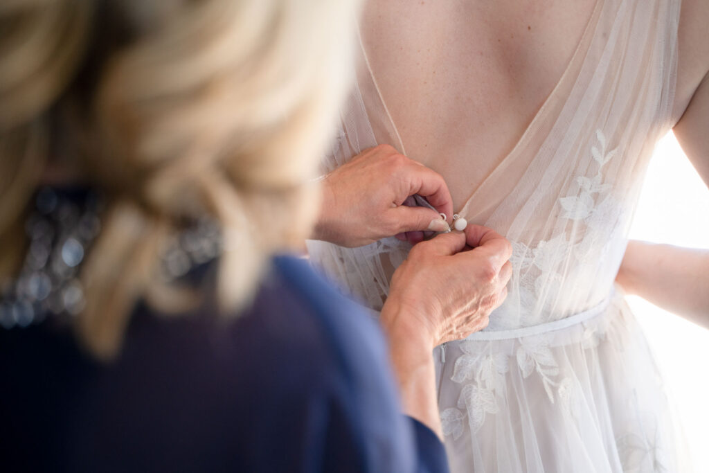 bride getting ready by Lake of the Ozarks wedding photographer The Bennetts