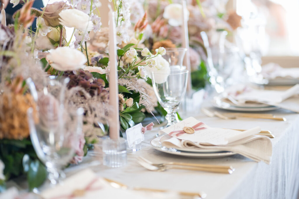 light pink wedding table setting by Lake of the Ozarks wedding photographer The Bennetts