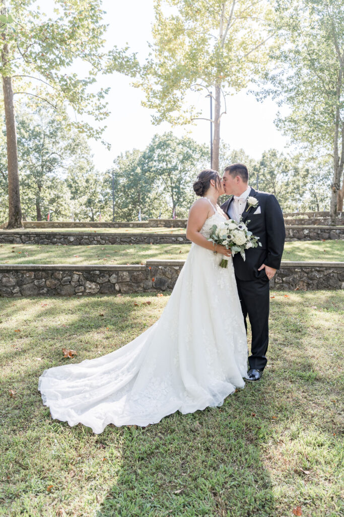 Our Lady of the Lakes brided and groom bride at Chateau Bouffemonte by Lake of the Ozarks wedding photographer The Bennetts