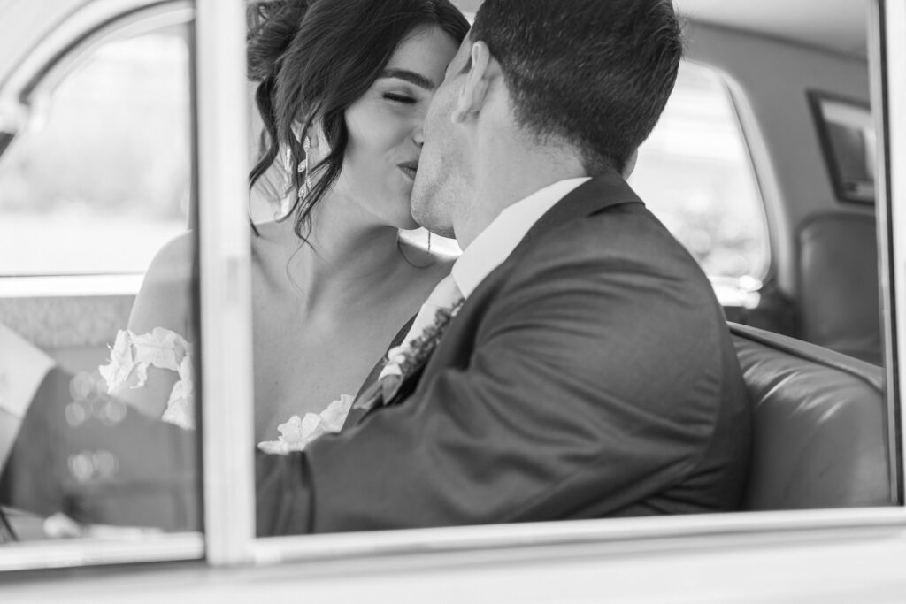 bride and groom in a car by Lake of the Ozarks Wedding photographer