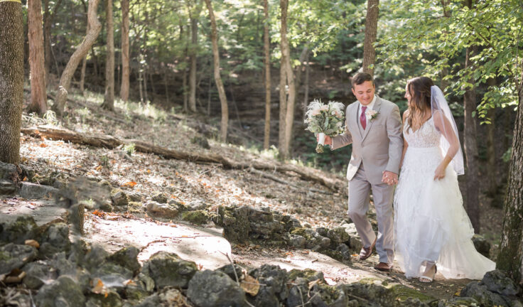 bride and groom in the woods y Lake of the Ozarks wedding photographer The Bennetts