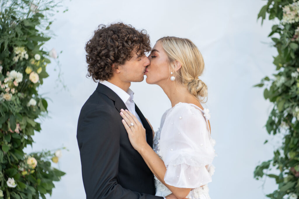 bride and groom kissing by Lake of the Ozarks wedding photographer The Bennetts