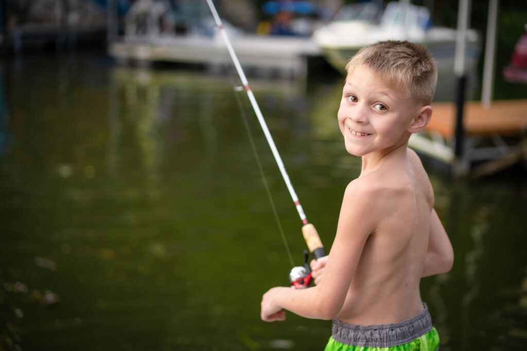 boy fishing by Lake of the Ozarks photographer The Bennetts