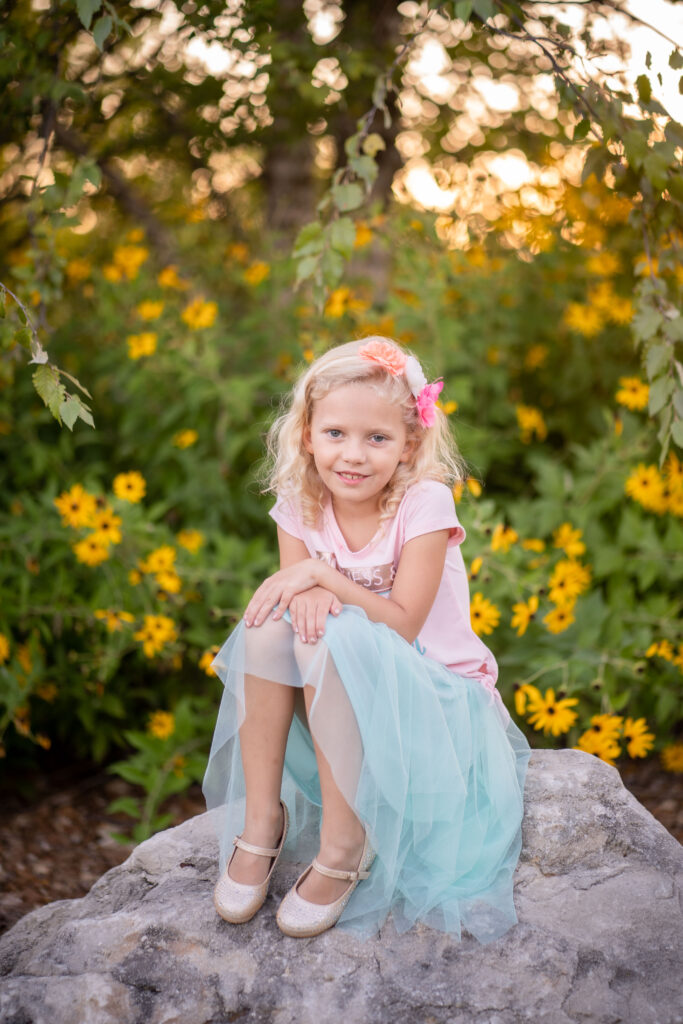 girl in the flowers by Lake of the Ozarks photographer The Bennetts